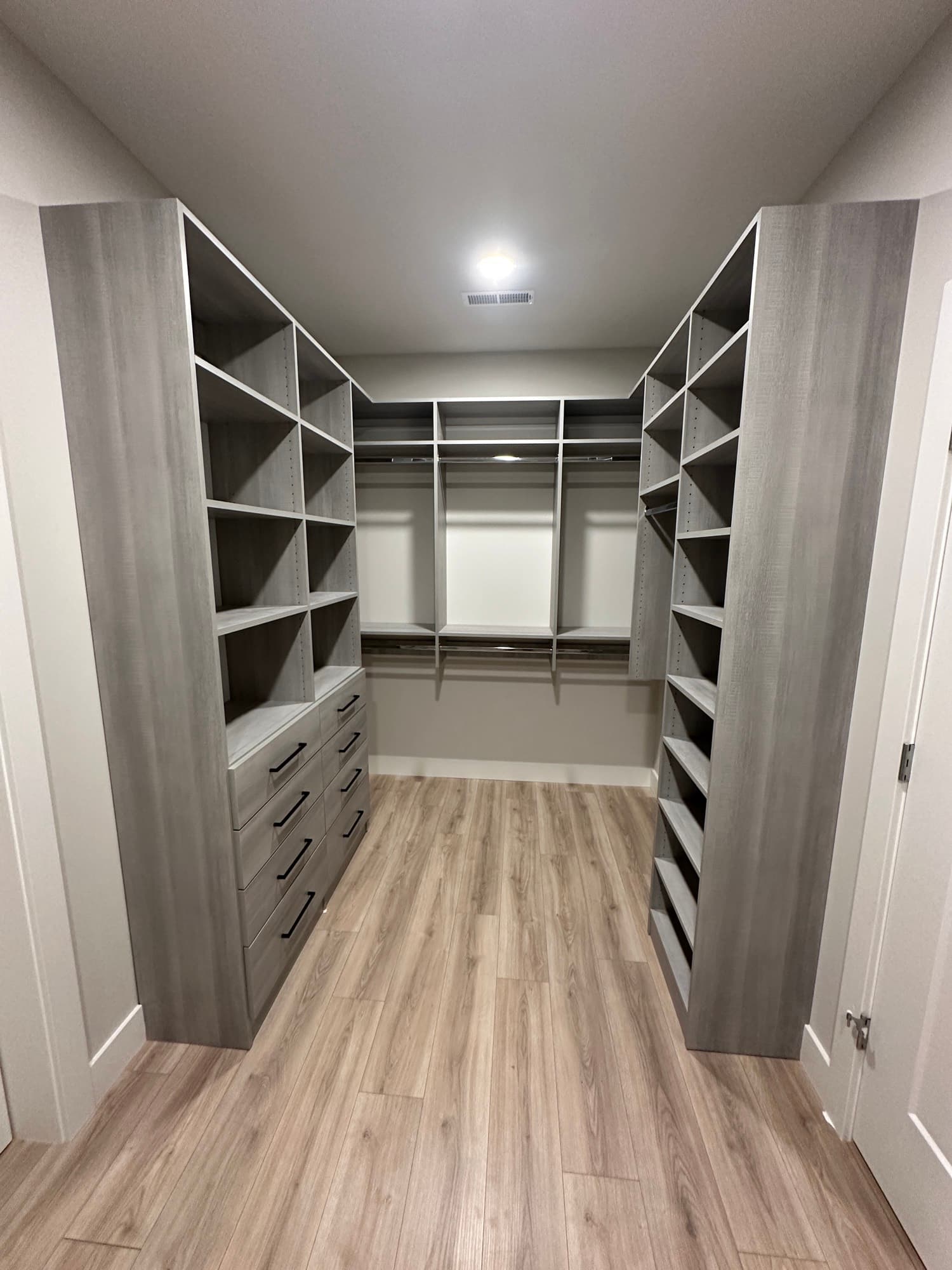 Custom walk-in closet with shelving in Centralia, MO