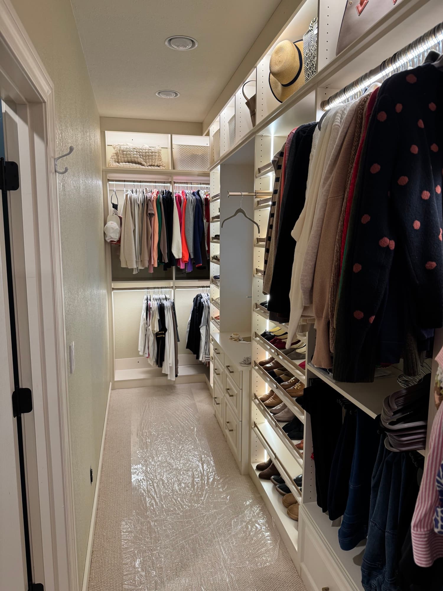 Oak walk-in closet with brass pulls