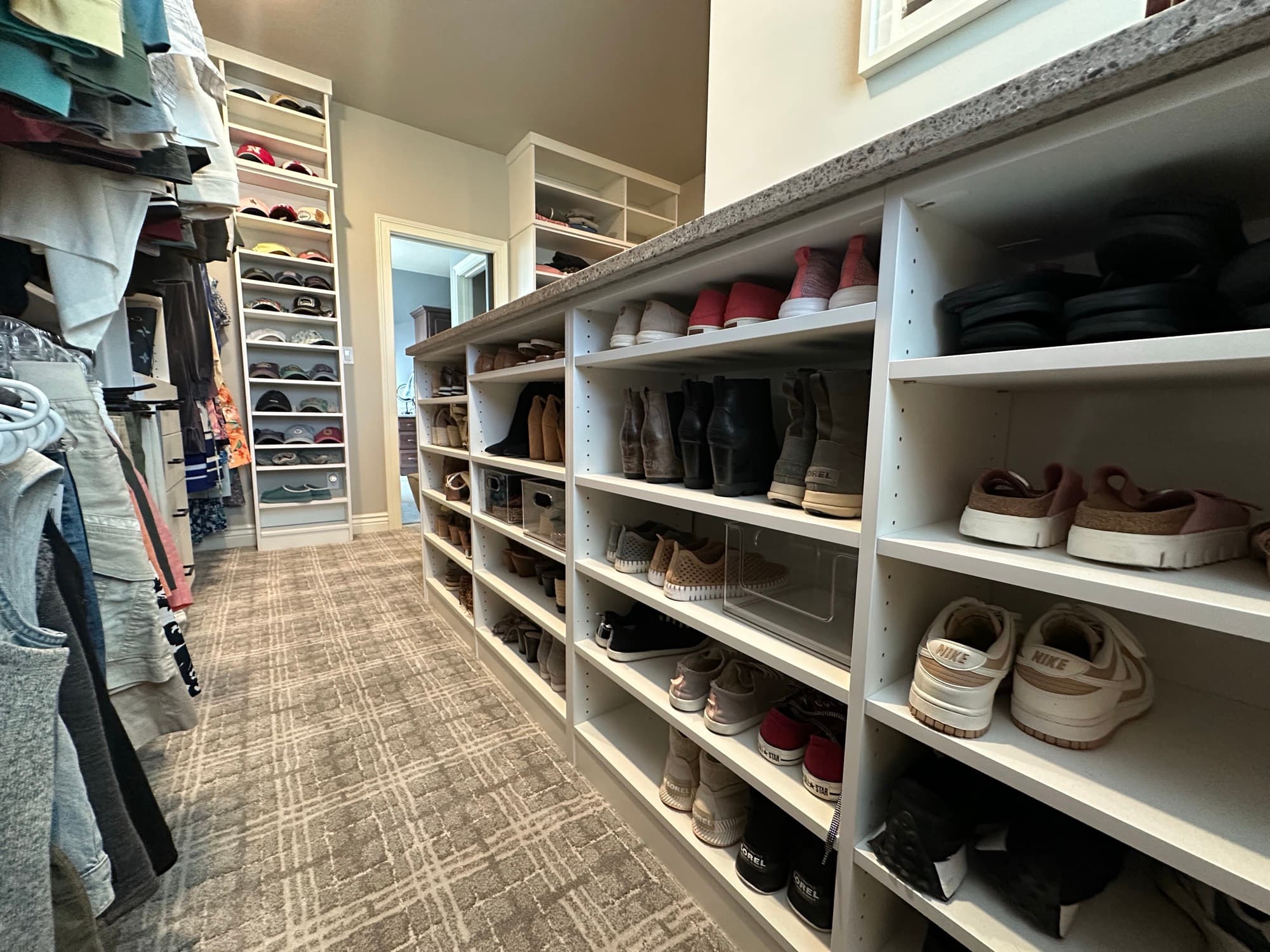 Custom built-in closet with drawers and hanging in mid-Missouri home