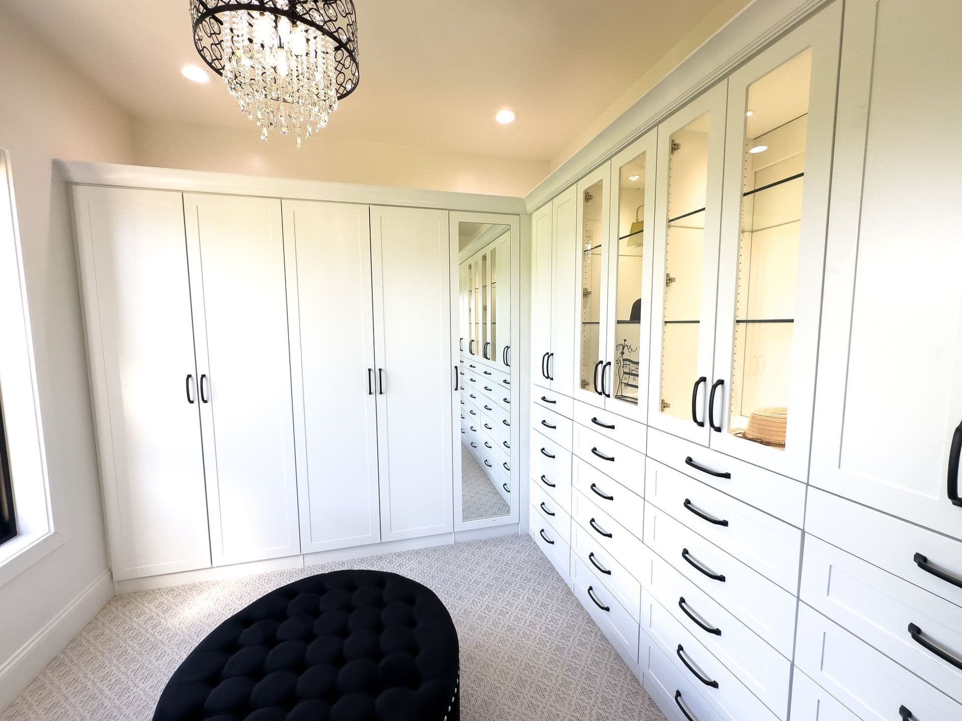 Guest-friendly walk-in closet with chandelier