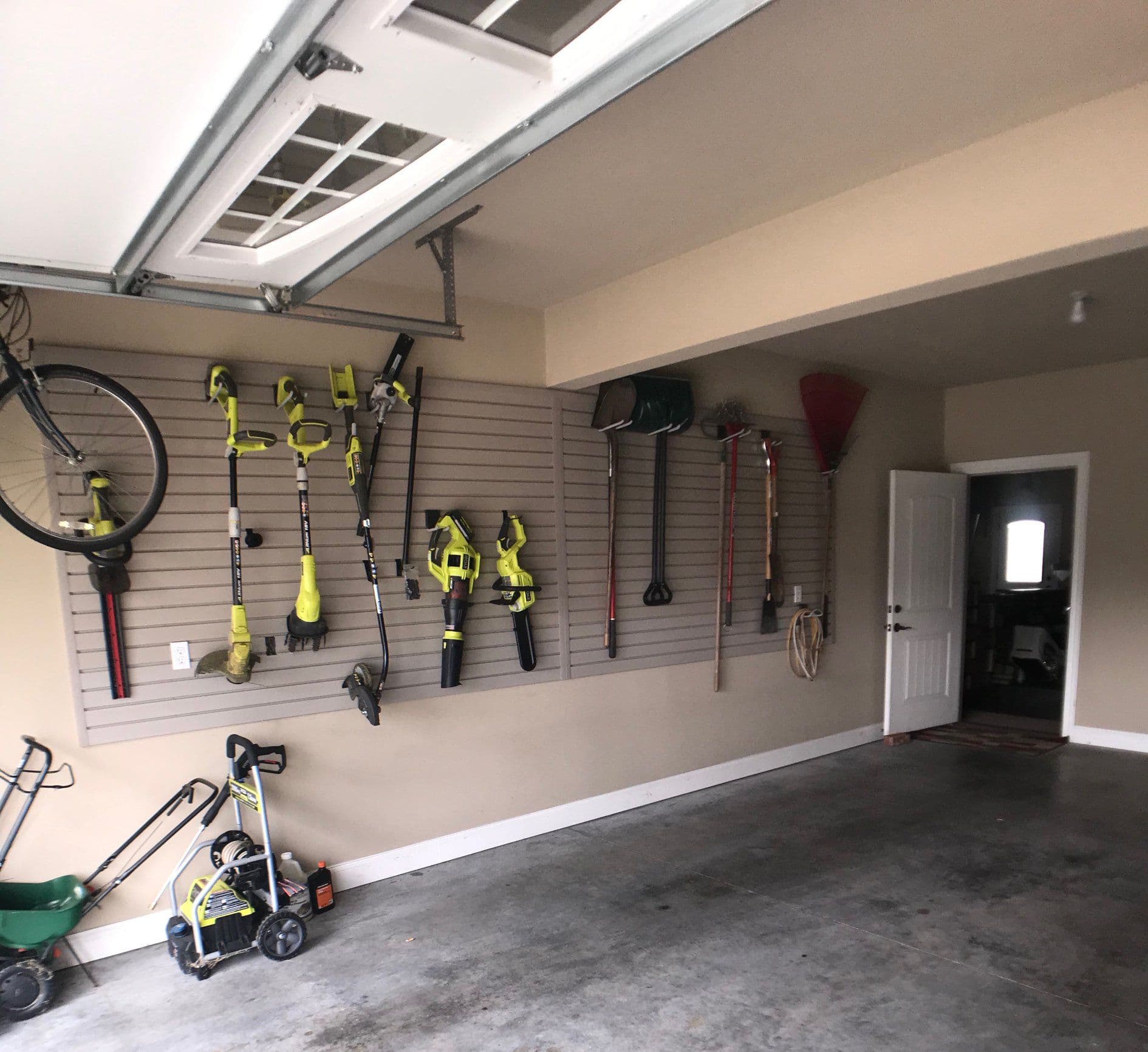Garage slatwall system with yard tools in Columbia, MO