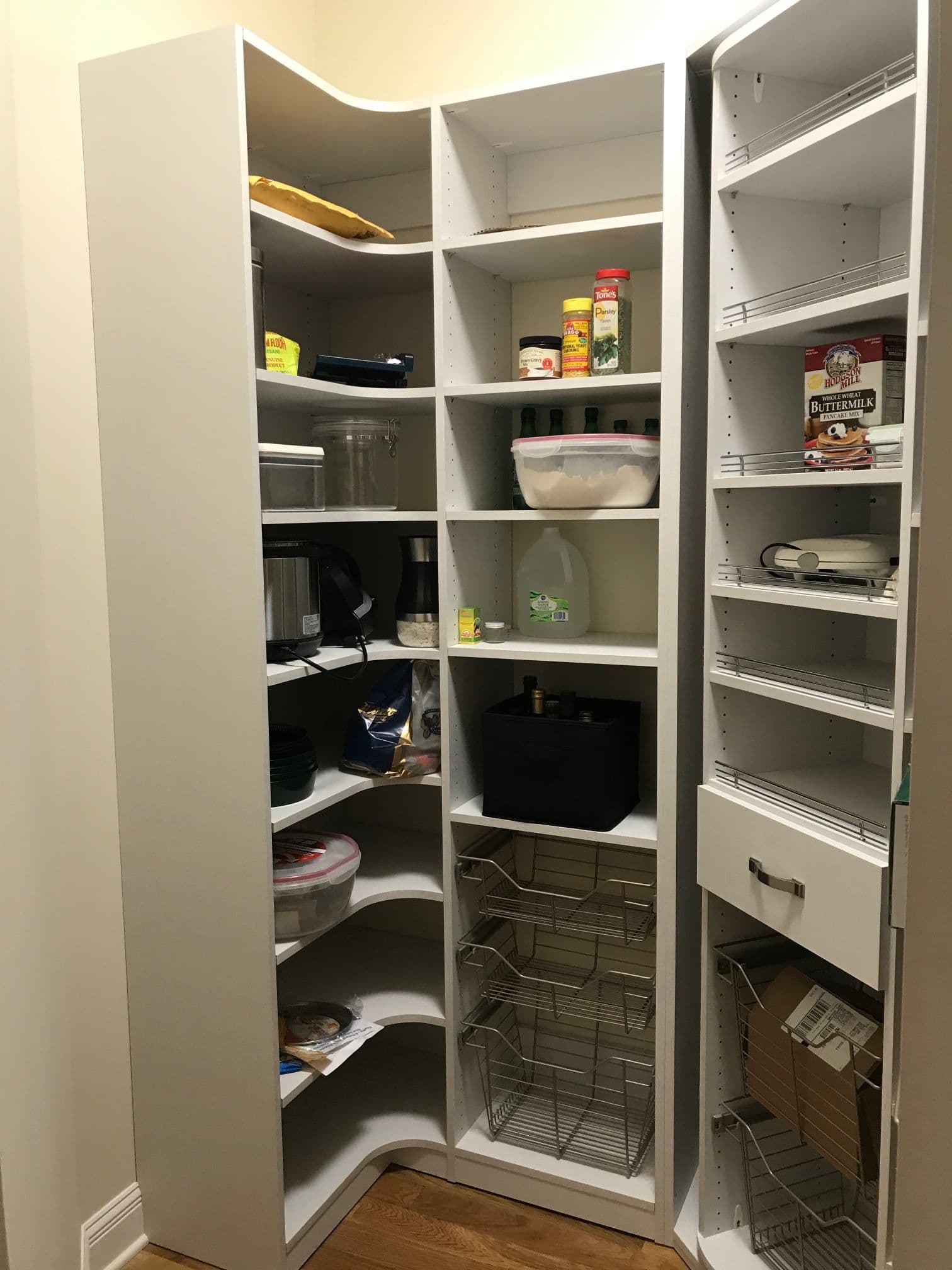 Custom pantry with pull-out baskets in corner